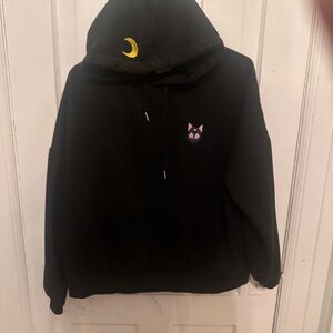 Large black hoodie embroidered with Luna and sailor moon crescent